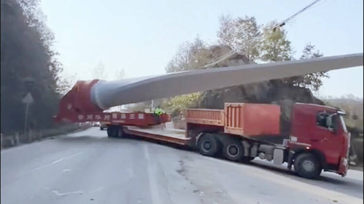 Blades Wind Turbine Transporting to the Mountain